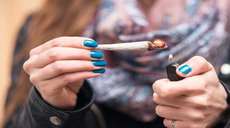 Woman holding a joint