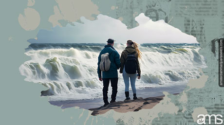 Felix and Emma stood facing the rough sea