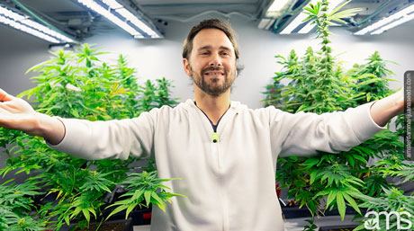 man in his grow room